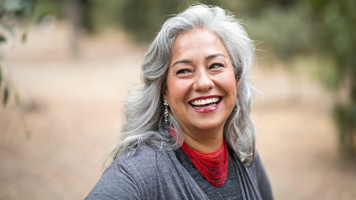beautiful mature woman with hair that showcases the smoky gray hair color