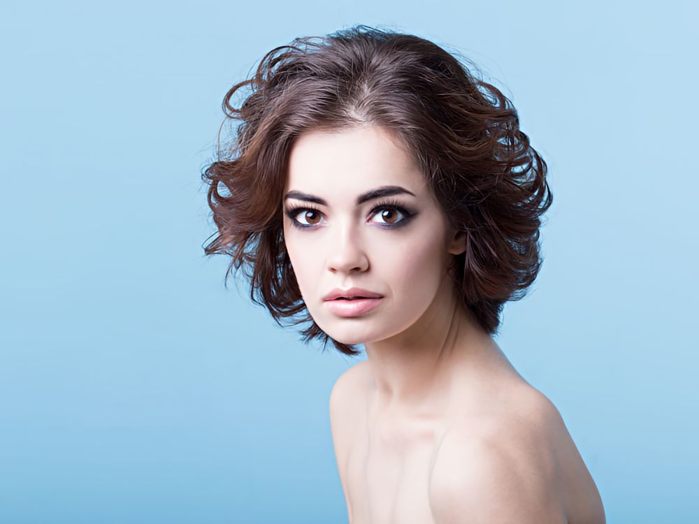 beautiful young woman with hair that showcases the chocolate melt hair color trend